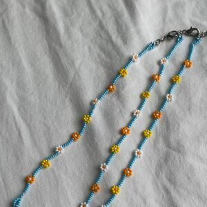 Yellow and blue beaded flower